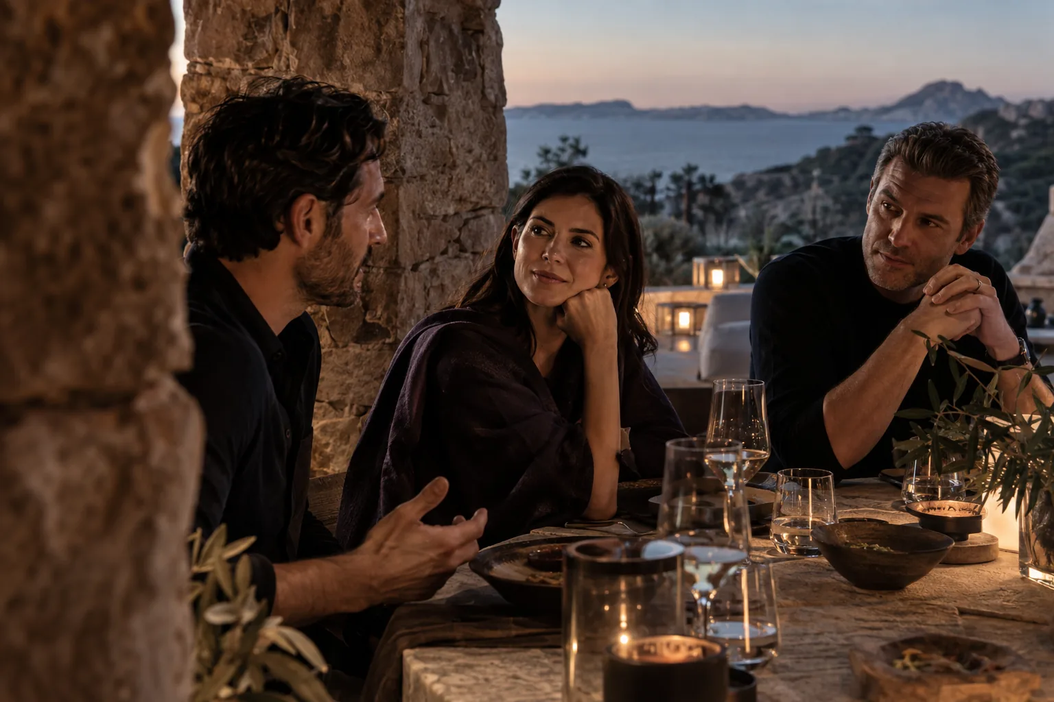 Three participants in a private dinner conversation