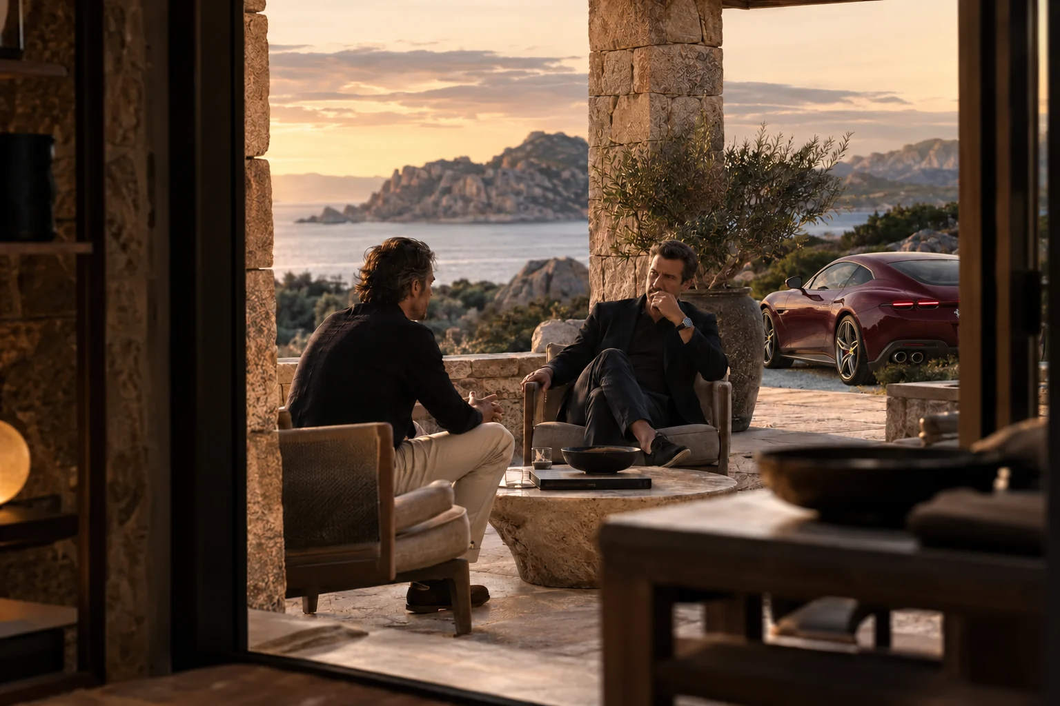 Illustrative scene: two founders in conversation on a terrace, with a burgundy Ferrari Roma beyond